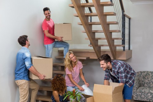Local removal team preparing a move in Cowley with packed boxes and furniture