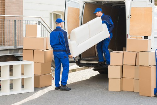 Man with a van loading household items in Cowley