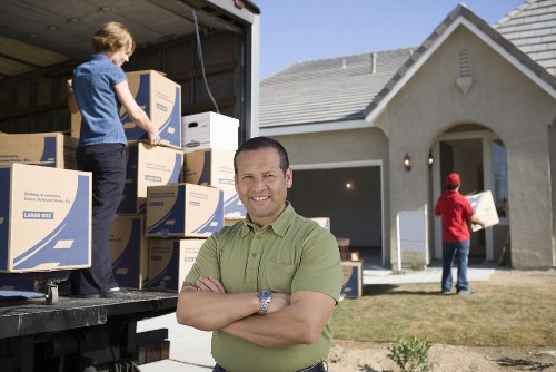 Professional moving truck helping with loading in Cowley
