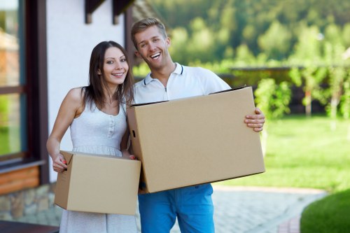 Professional movers handling business furniture during an office relocation