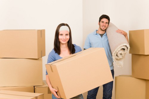 Professional movers packing household items in Cowley