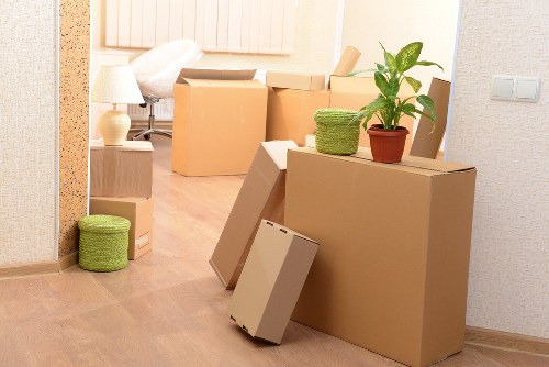 Boxes and furniture being loaded into a removal truck