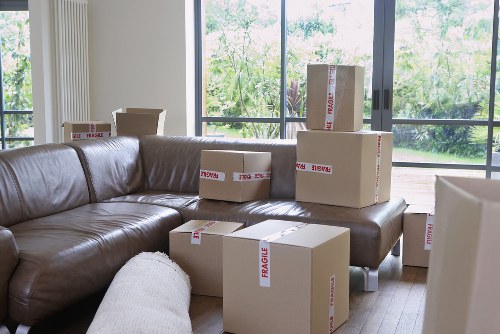 Loading boxes and furniture into a van in Cowley